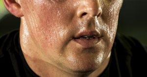 8 Warning Signs You May Have a Vitamin D Deficiency The lower half of a sweating face