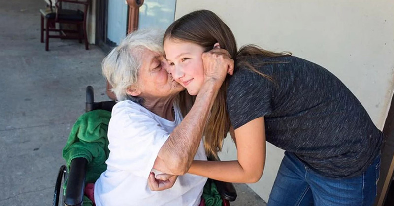older woman kissing teenage girl