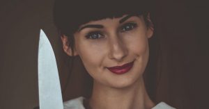 You Can Spot Any Psychopath by Looking for These 8 Warnings Woman with dark hair and red lips smiling