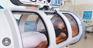 Person undergoing Hyperbaric Oxygen Therapy in a hyperbaric chamber
