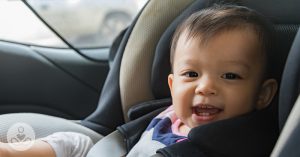 Being an Aunt Makes Your Life Take a Beautiful Turn baby boy sitting in a car seat smiling with open mouth showing teeth