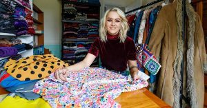 girl with fabric on a table