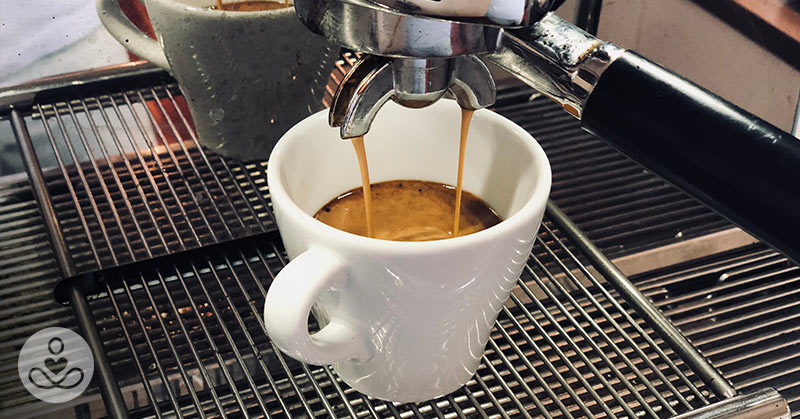 espresso brewing into a cup