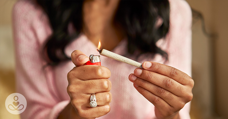 woman lighting a joint
