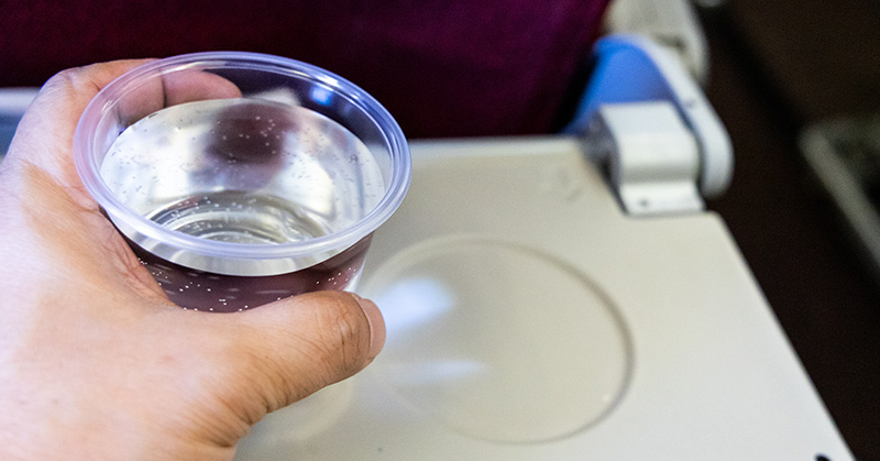 cup pf water on airplane