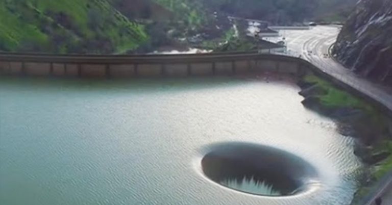 Watch: Giant Hole Sucks In Excess Storm Water In California Lake - Featured image