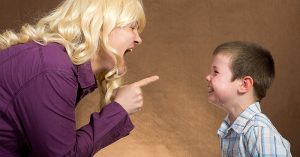 How Yelling at Your Kids Actually Affects Them woman yelling at little boy