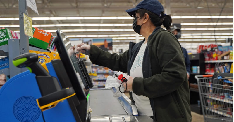 woman at self checkout