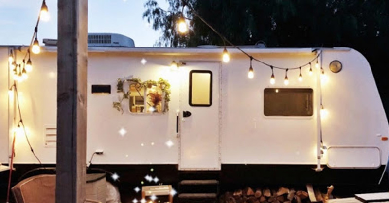 A Couple Spend $3K to Turn an Old RV Into a Cozy Home For Five - Featured image