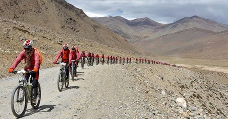 Hundreds of nuns trained in Kung Fu biked the Himalayas to oppose human trafficking - Featured image
