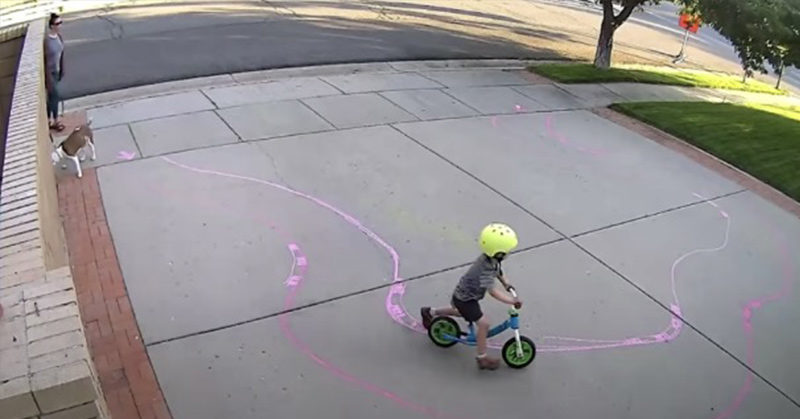 kid playing in driveway