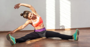 10 Stretches to Relax Your Spine After a Hard Day woman stretching