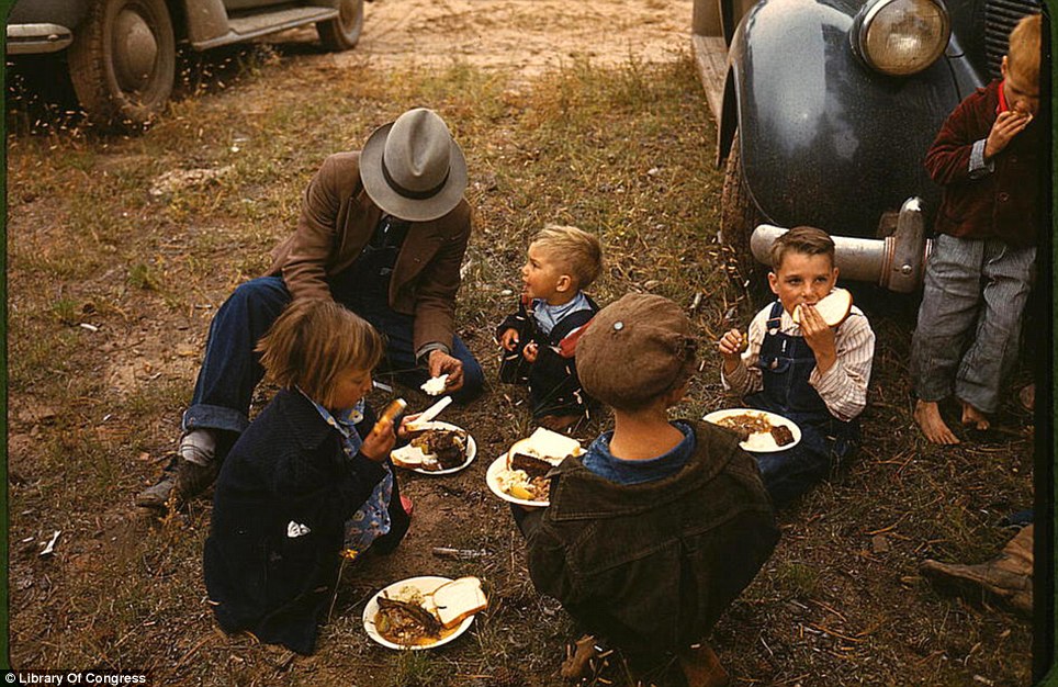 A homesteader and his kids eating at a barbeque at the New Mexico Fair in Pie Town