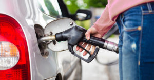 man pumping gas