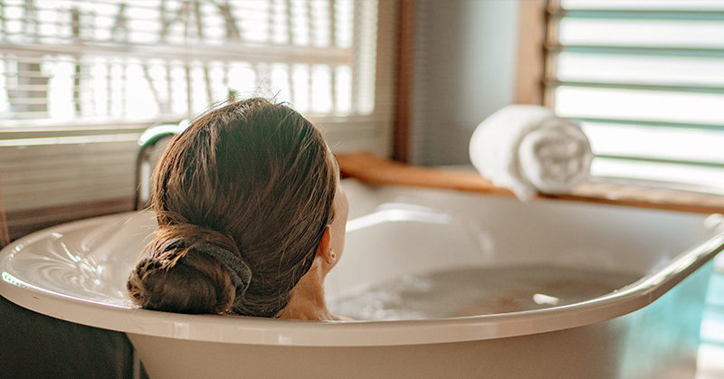 woman soaking in bathtub