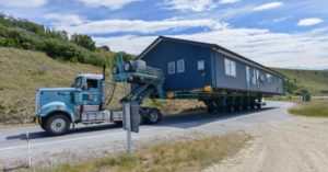 This Massive Container Home Mansion Is a Must See container home on flatbed truck