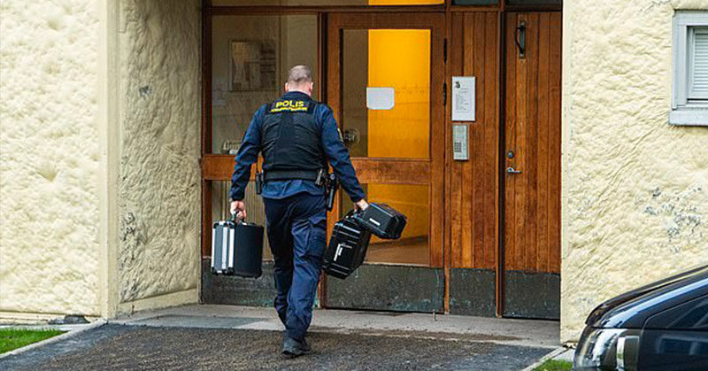 policeman walking into building