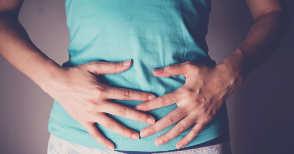 woman hands on her stomach