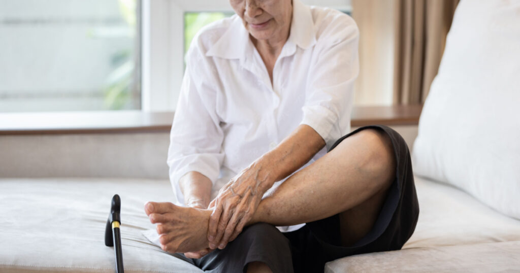 Old elderly with foot injuries,ankle bone diseases,heel pain or soles,asian senior woman suffering from peripheral neuropathy,beriberi,nerve inflammation of the foot, numbness of the feet and toe