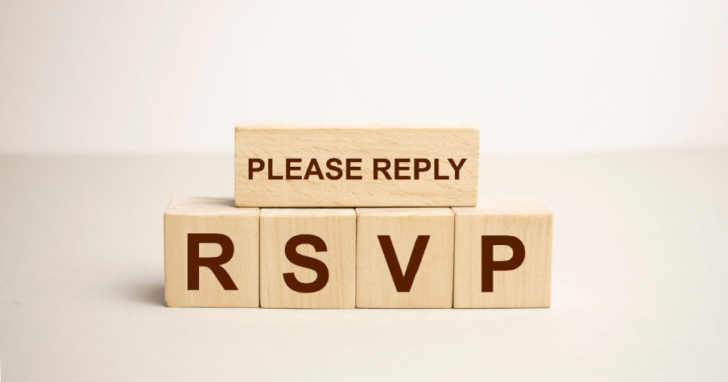 Word rsvp. Wooden small cubes with letters on the table