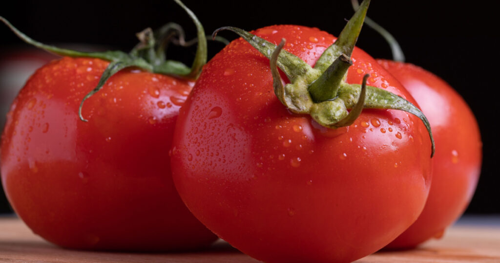 Tomato is a round, juicy fruit with a smooth and shiny skin