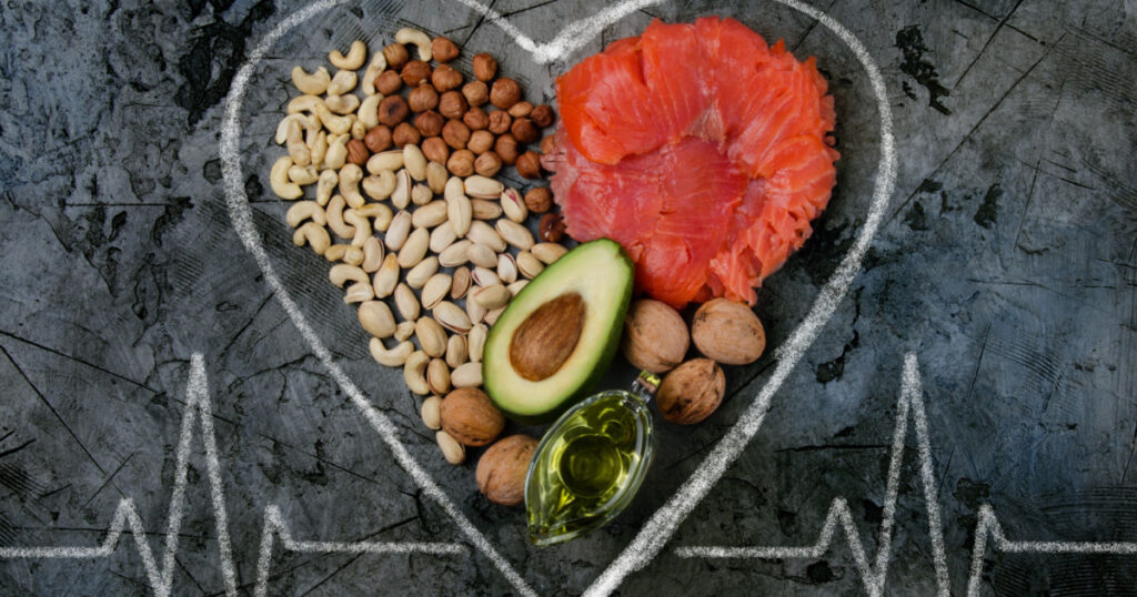 Healthy fats for heart on dark stone background