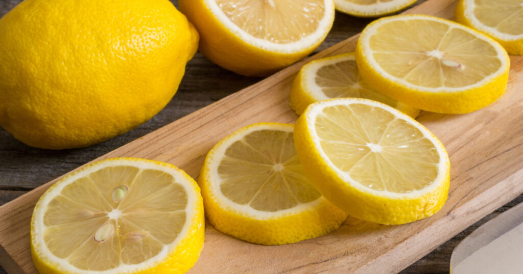 Lemon slices on the old wooden table.