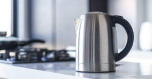 This Hot Water Migraine Trick Can Help Ease Your Headache Without Side Effects electric kettle on countertop