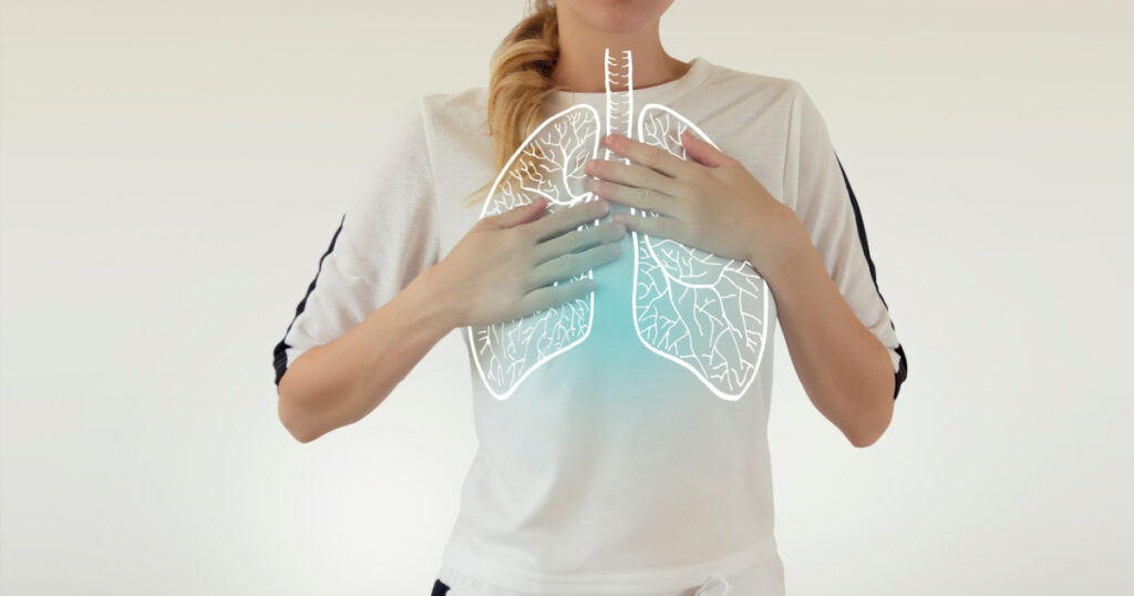 highlighted blue healthy lungs on woman body
