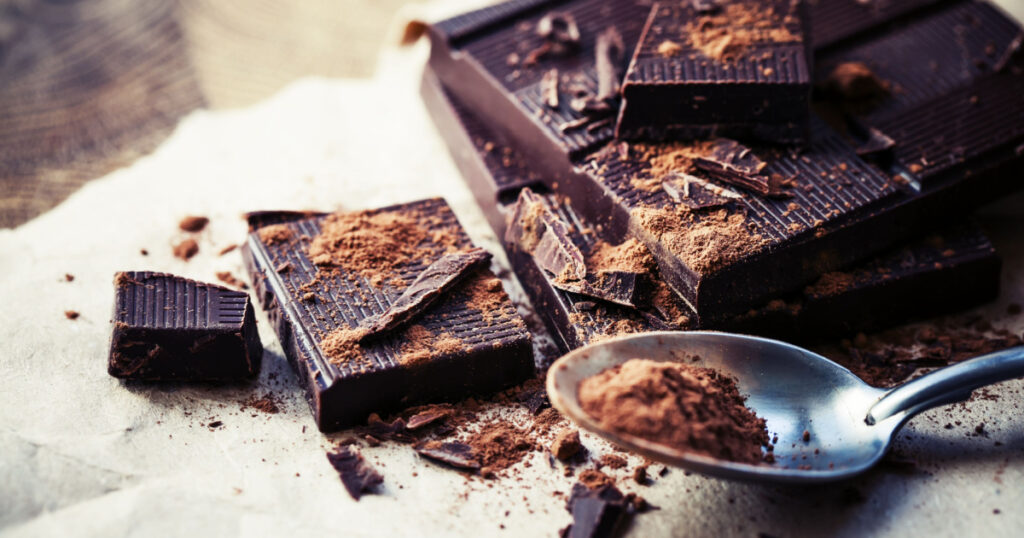 dark chocolate weight loss foods over wooden background
