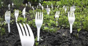 8 Gardening Hacks That Will Help Flowers, Veggies, And Fruit Flourish forks in a garden