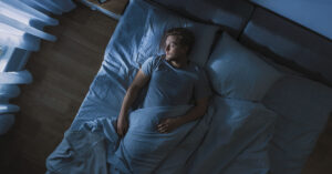 person sleeping in bed