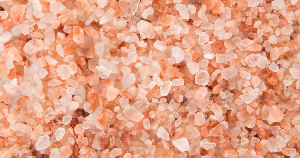 Pink Himalayan coarse grain salt texture. Top view.
