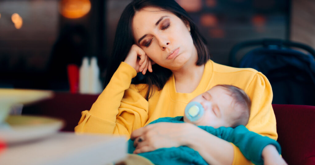 tired mom and baby