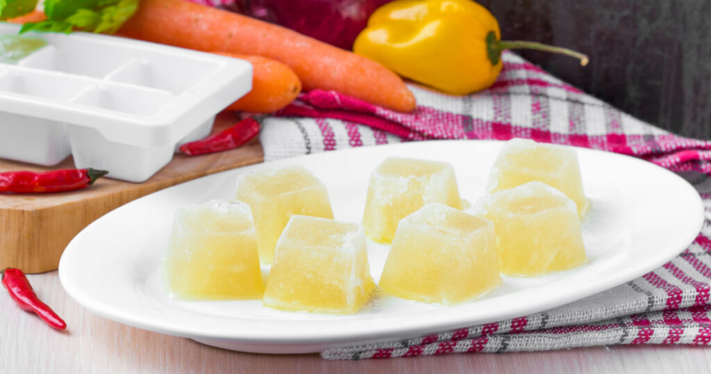Homemade frozen vegetable broth ice cubes, preparation for future