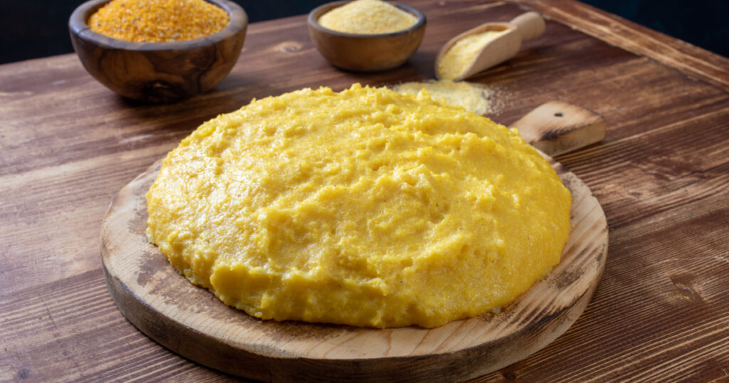 traditional polenta on chopping board rustic background

