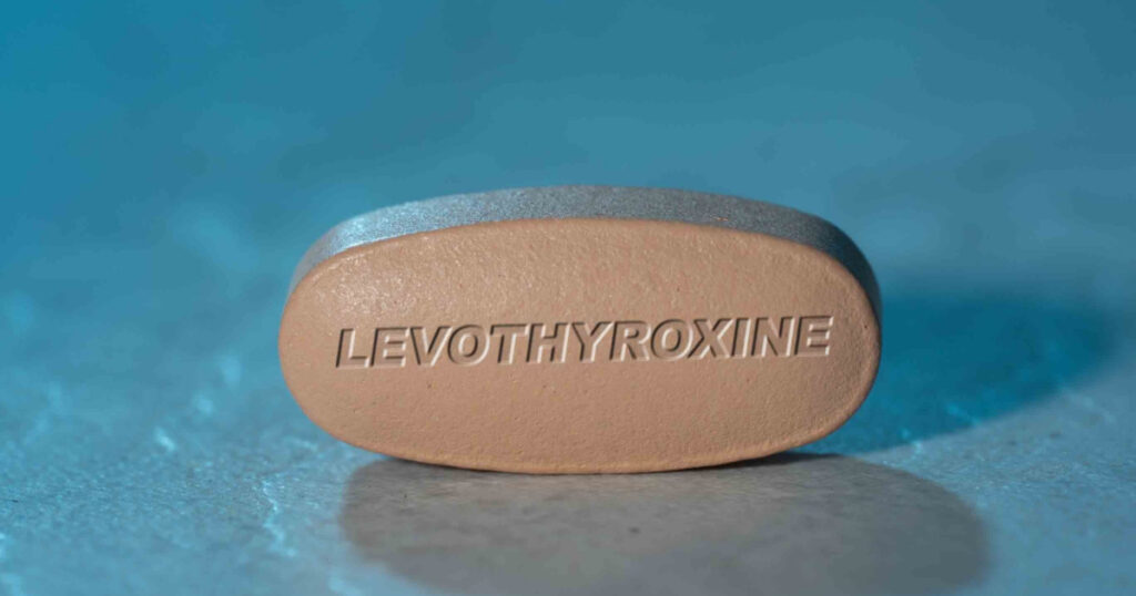Levothyroxine drug Pill Medication ob blue background
