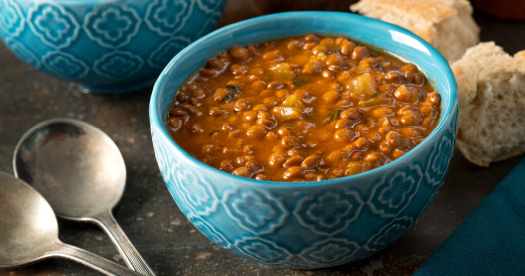 A bowl of delicious hearty homemade curried lentil soup.
