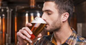What Happens To Your Body When You Quit Alcohol For 30 Days? man drinking beer
