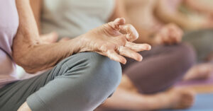 older woman practicing yoga