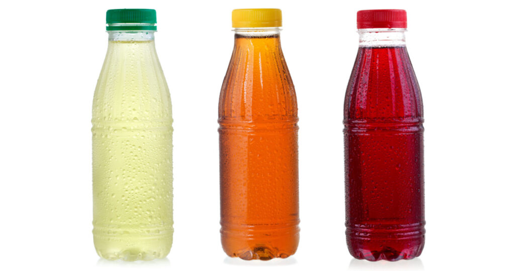 set with different bottles of ice tea on white background
