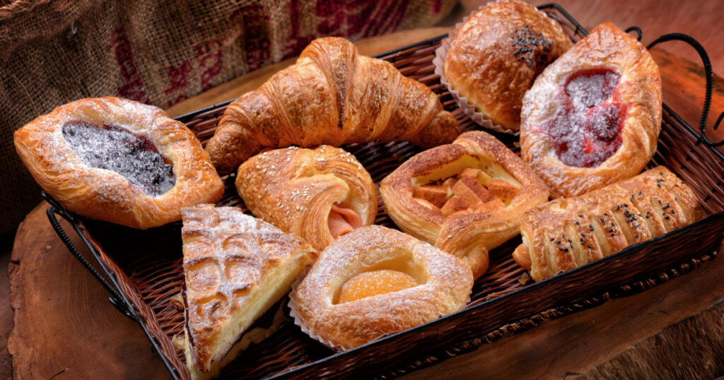 Selection of French & Danish pastries on a Wicker basket
