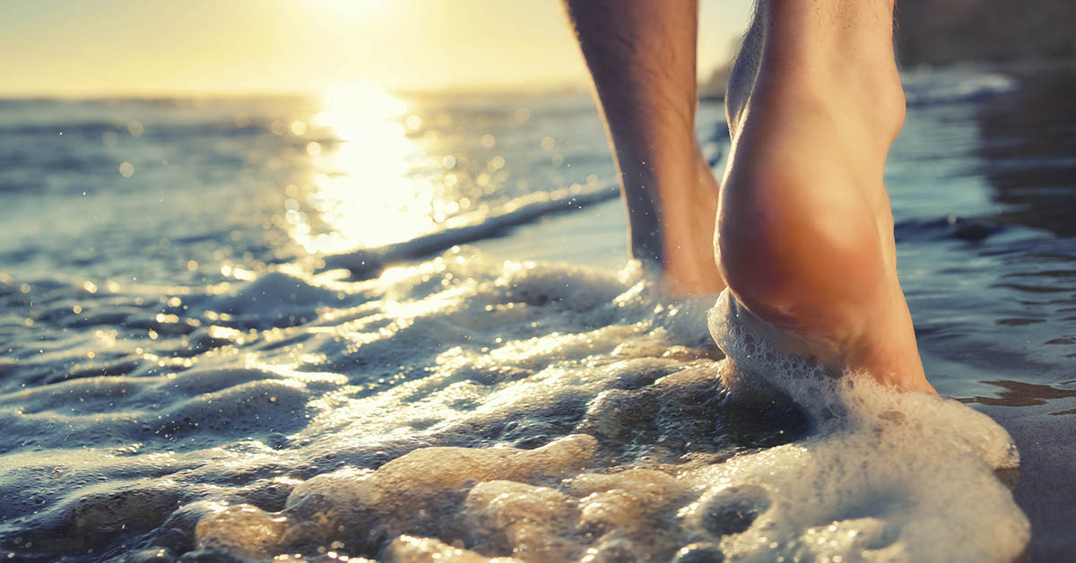 feet walking on beach