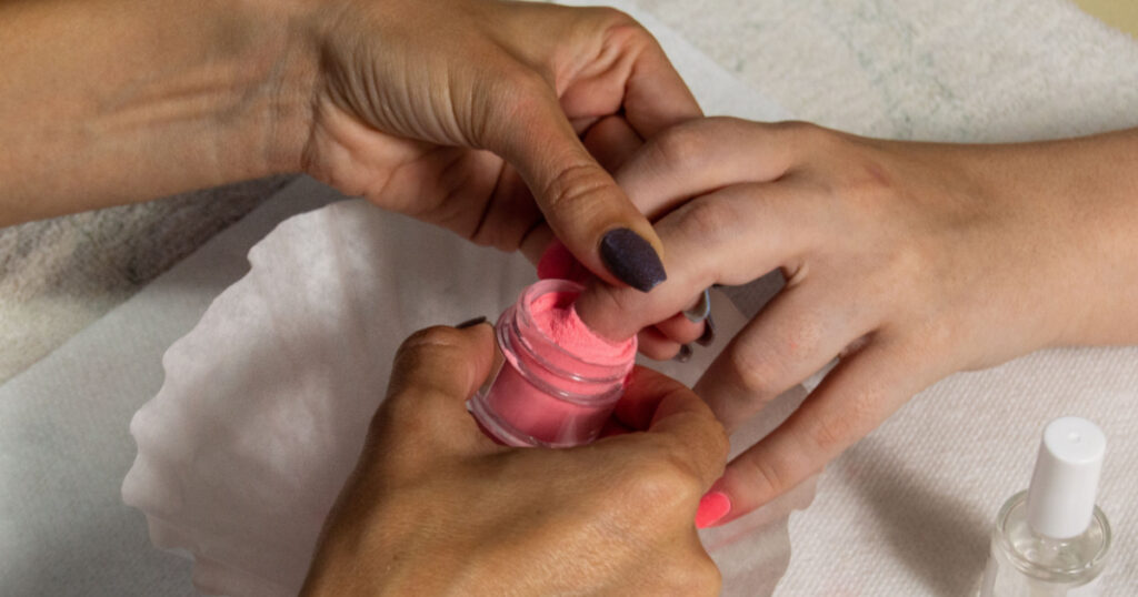 Woman Claims She was Left with Bloody Swollen Fingers After Receiving a Popular Type of Manicure - Featured image