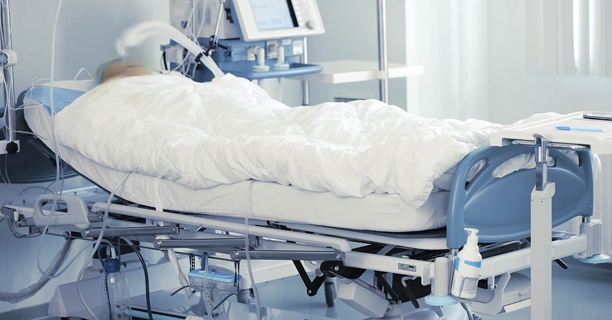 man laying on hospital bed. Coma concept