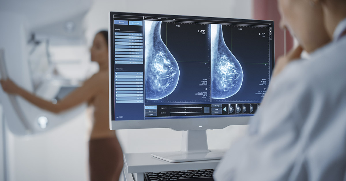 medical professional taking mammogram of a female patient. Cancer concept