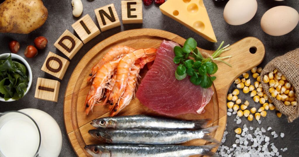 Foods rich in iodine on grey background.