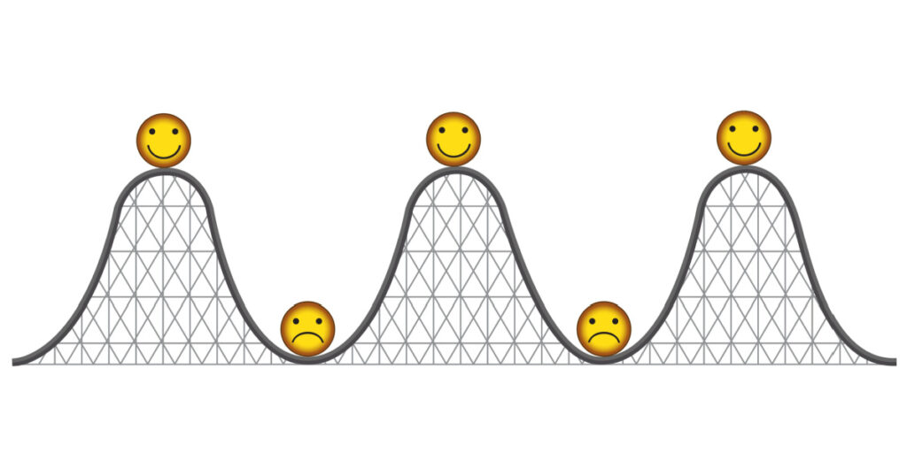 Vector image of a roller coaster with happy and sad faces - mental health and happiness
