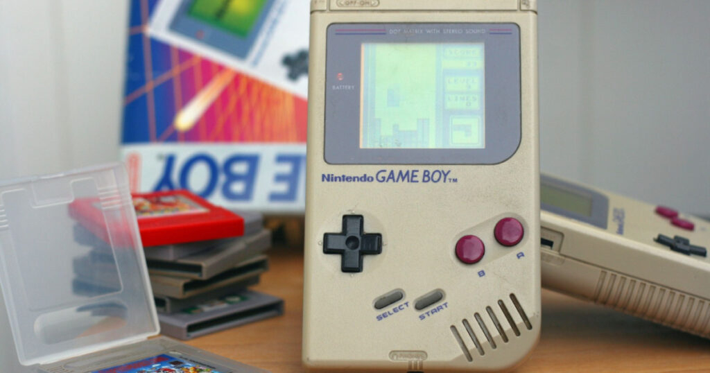 LJUBLJANA, SLOVENIA - DECEMBER 30, 2013: Photo of an original Nintendo handheld video game device Game boy (1989) with Tetris game playing.Showing obvious signs of longtime use.