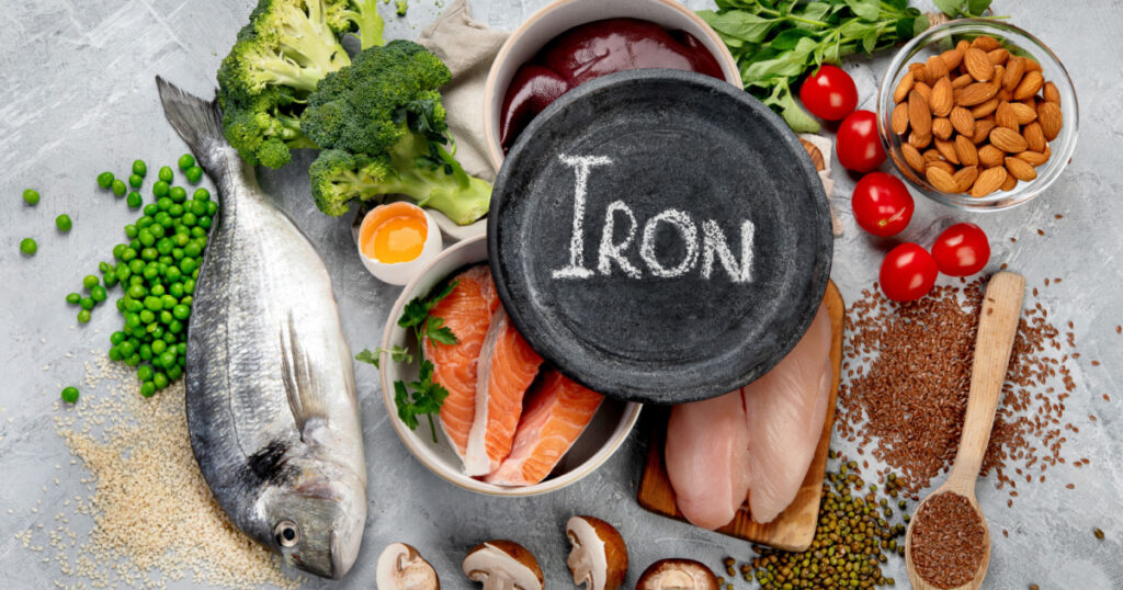 Food high in iron on light gray background. Healthy eating concept. Top view, flat lay
